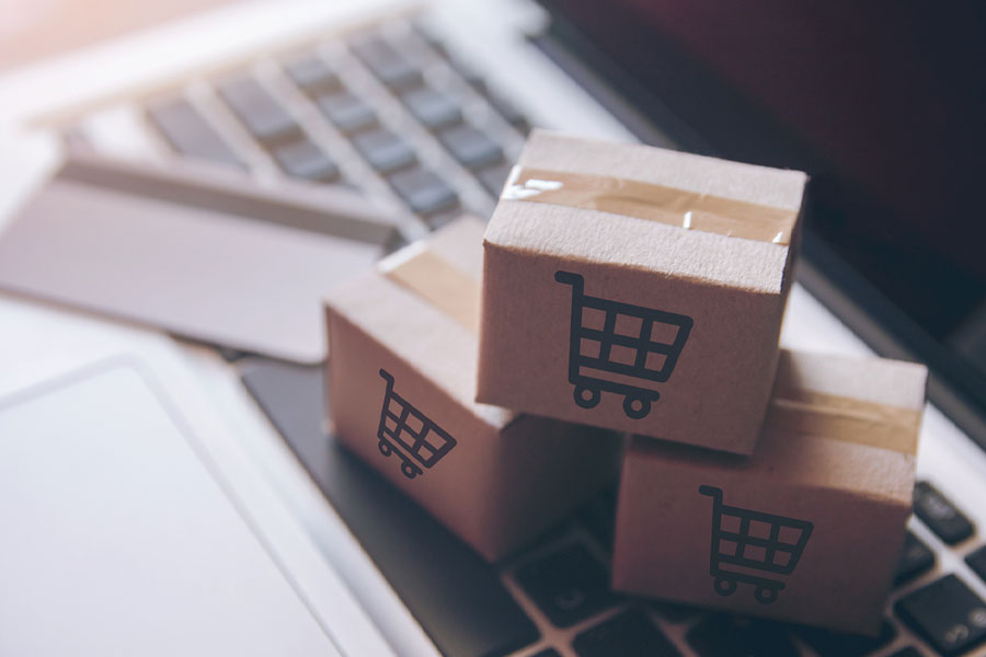 Photograph of packages with shopping carts printed on them.