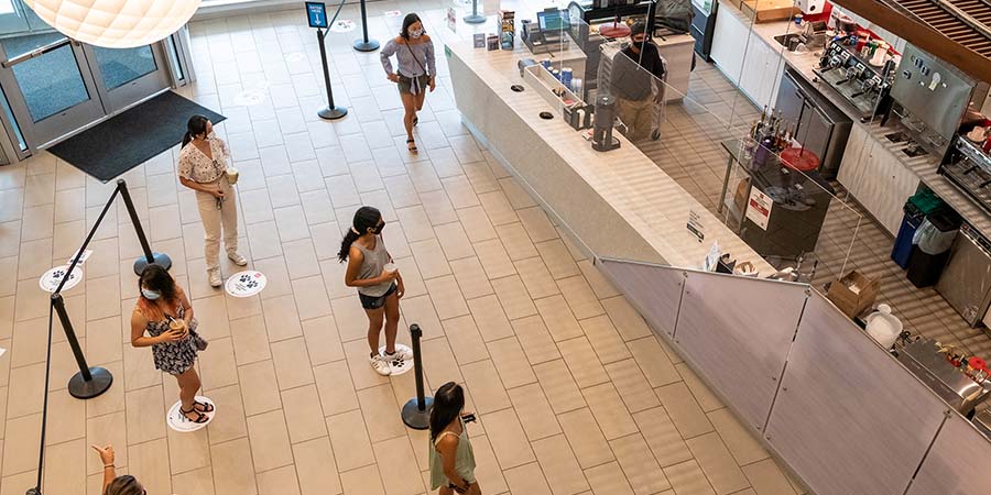 Students social distancing at campus dining spot
