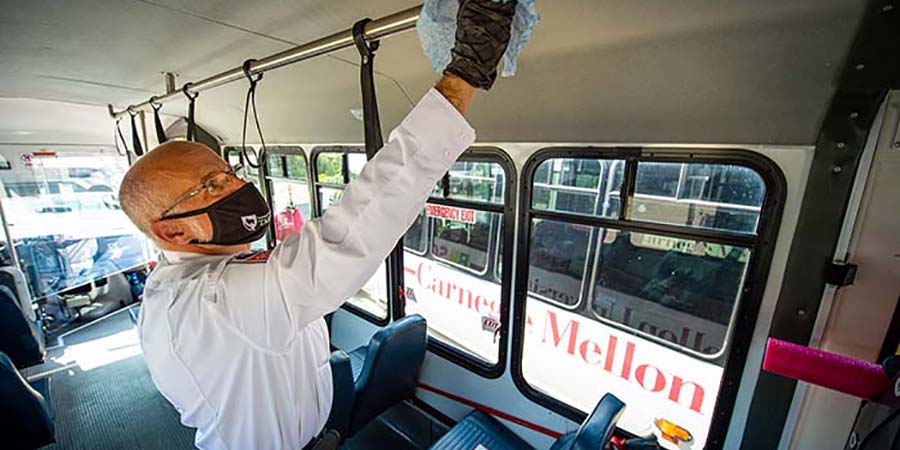 CMU shuttle bus being cleaned