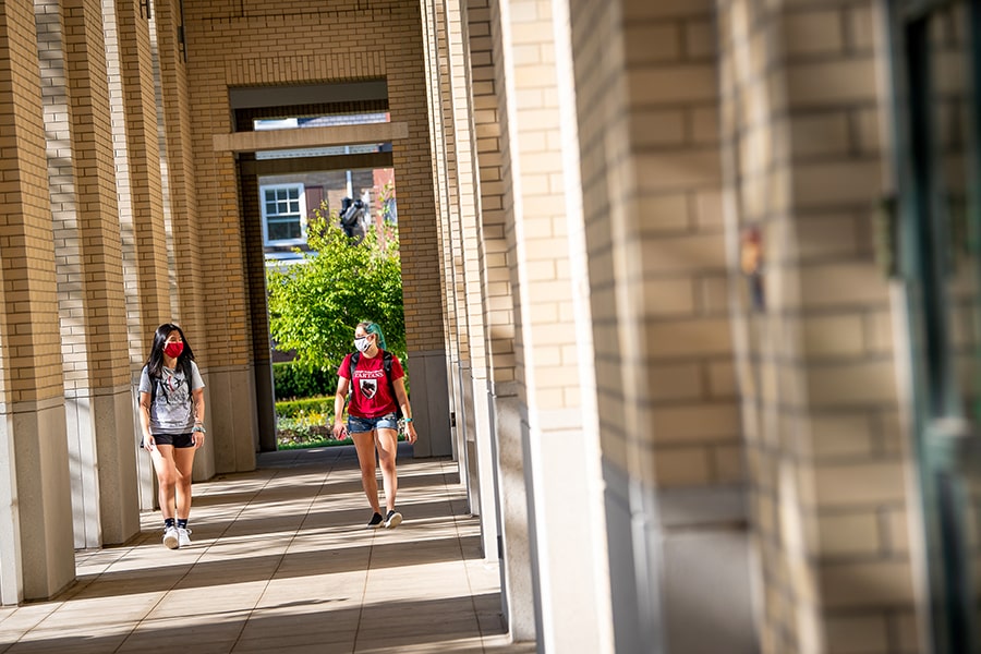 two students walking on campus