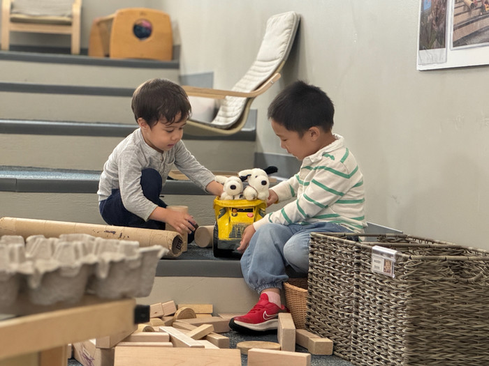 child on light box and view of studio
