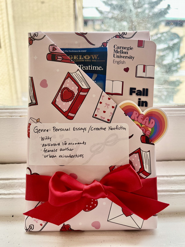 book wrapped in valentine's day paper and red ribbon