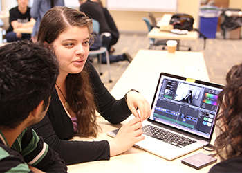Students edit a video on their time in Cuba.