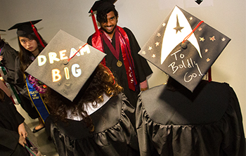 Two decorated hats read 