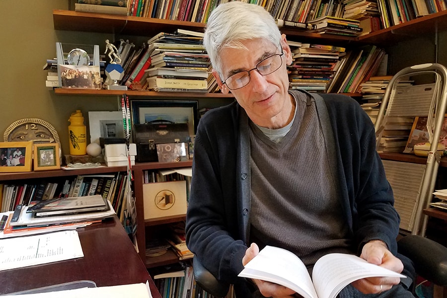 Jim Daniels in his office reading from his new collection of poetry "Street Calligraphy."