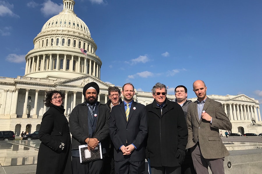 David Shumway and Christopher Warren with group of humanists on steps of Capitol Building.