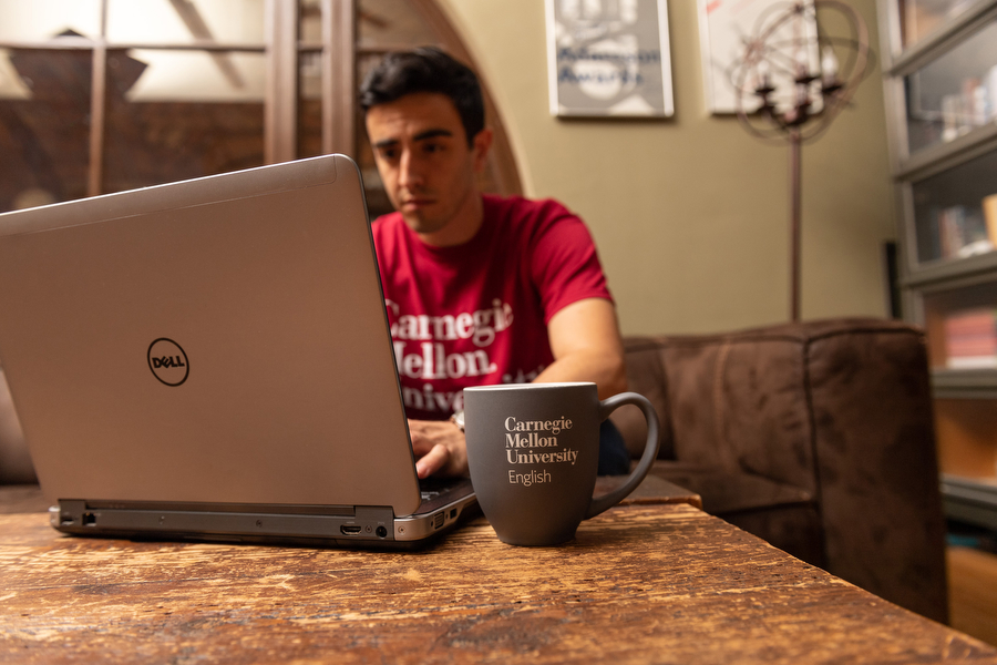 student sitting with laptop