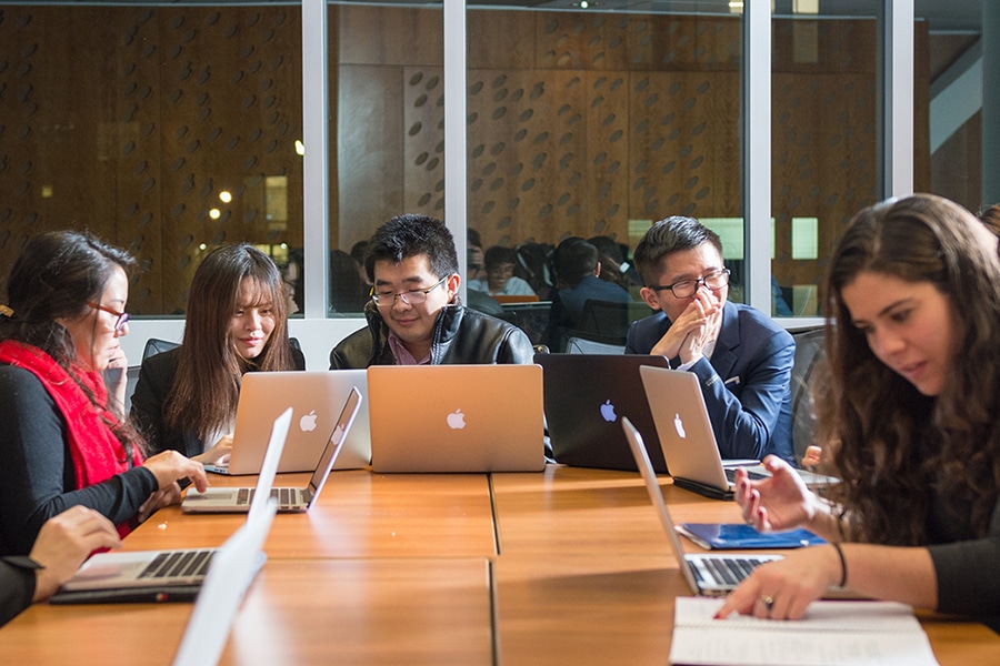 People working around table