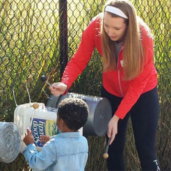 Gretchen Lankford plays with a small child