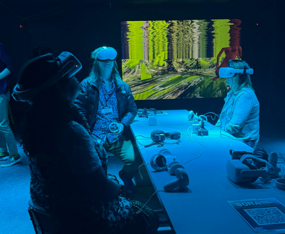 Participants interacting with VR headsets