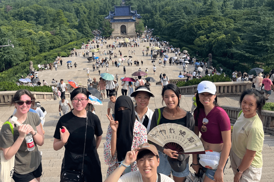 Group of students pose for a photo during the daytime in Shanghai, China