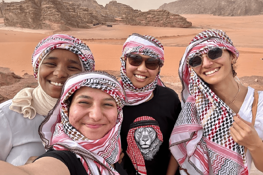 Four students pose for a selfie in Amman, Jordan