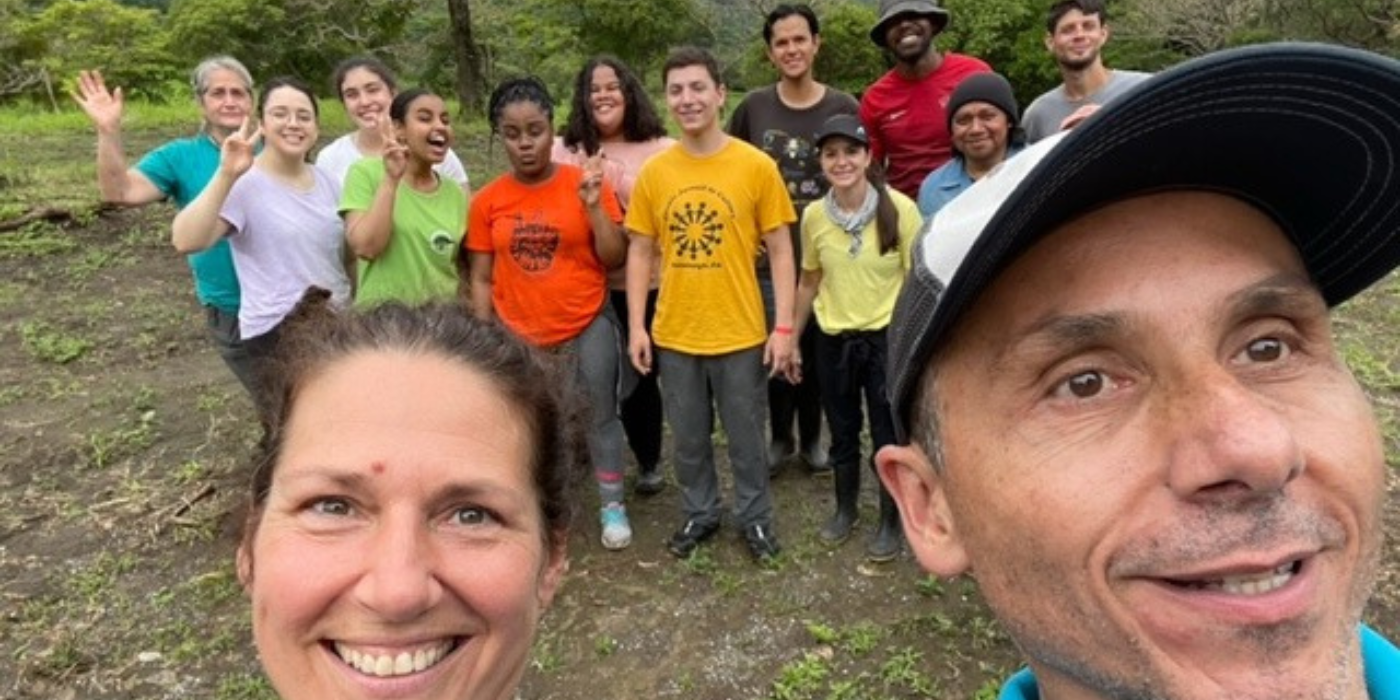 Students and instructors pose for a group selfie during a study abroad trip in Costa Rica