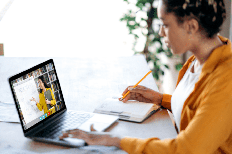 Woman uses laptop to take an online course