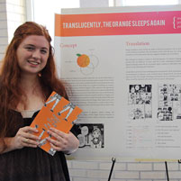 English Student Lauren Berry poses with her poster at Meeting of the Minds