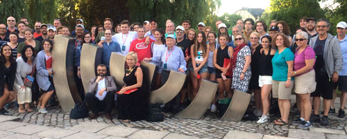 entire tour group at the menorah sculpture in Kielce, where Jews returning home after the Holocaust were murdered in 1946