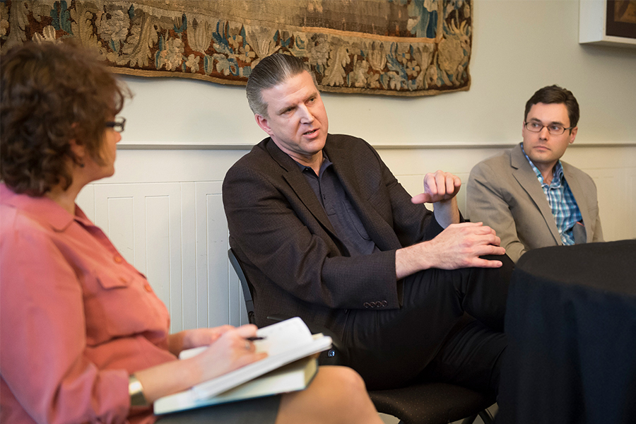 English Department Head Andreea Ritivoi (left) talks to Professors Doug Coulson and Gregory Laski about research from their latest books.