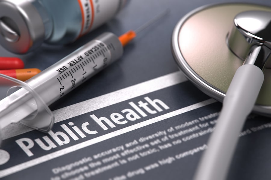 An image of a stethoscope, syringe and vial with the words "Public Health"