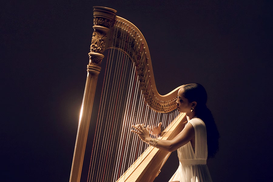 Madison Calley playing the harp