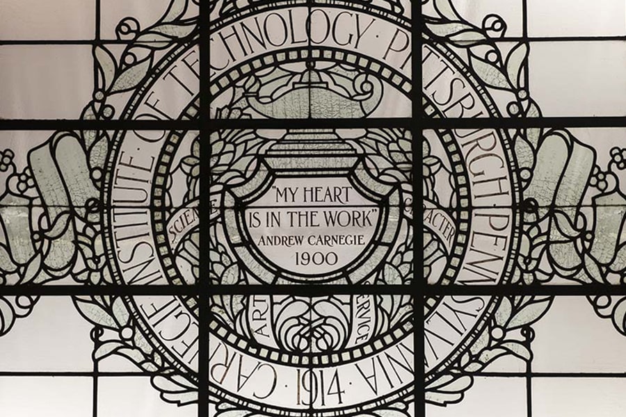 Leaded glass ceiling in Baker Hall that reads "My Heart is in the Work"