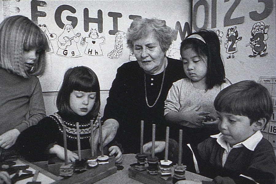 Ann Baldwin Taylor working with a small group of children