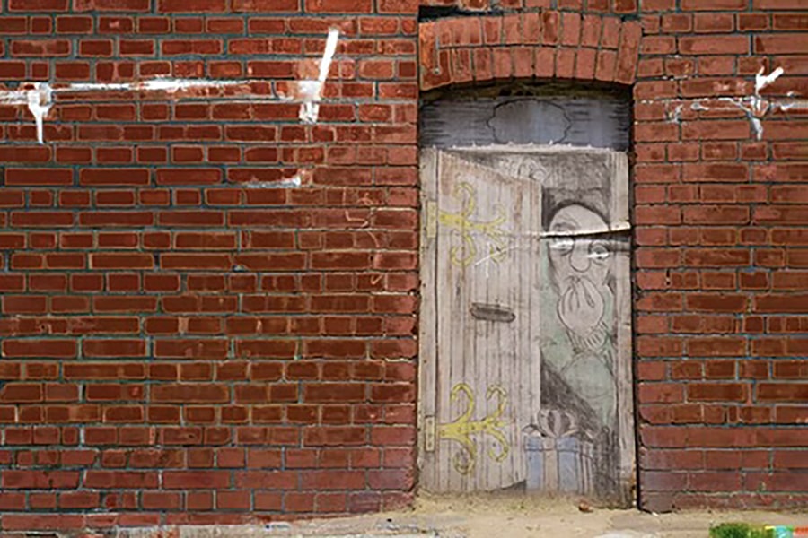 A painted door on a brick building