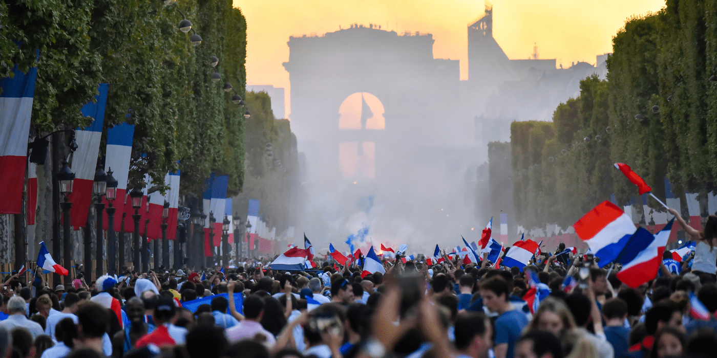 Celebration on the Avenue des Champs-Élysées in Paris, France following the 2018 FIFA World Cup. Photo by Tommy Larey.