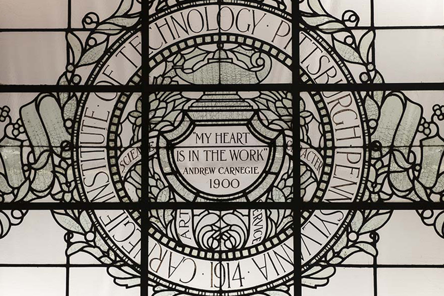 leaded glass ceiling in Baker Hall that reads "My Heart is in the Work"