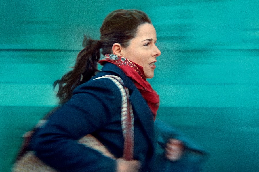 An image depicting Julie Roy (Laure Calamy) rushing to her next task in the film “Full Time.” credit: Music Box Films
