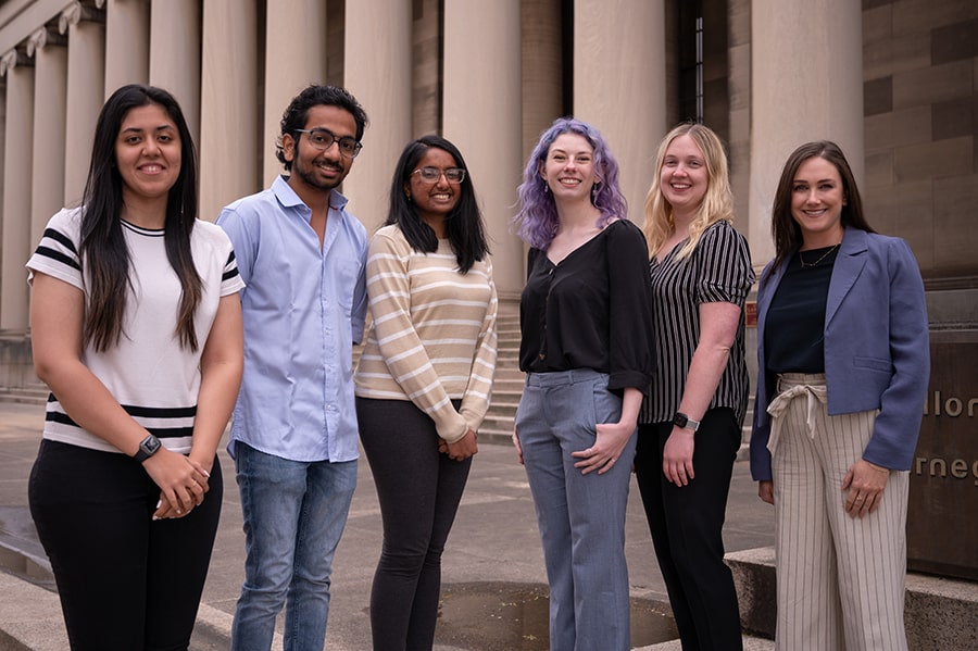 MS-DAS students and CMU alumni in front of the Mellon Institute Columns