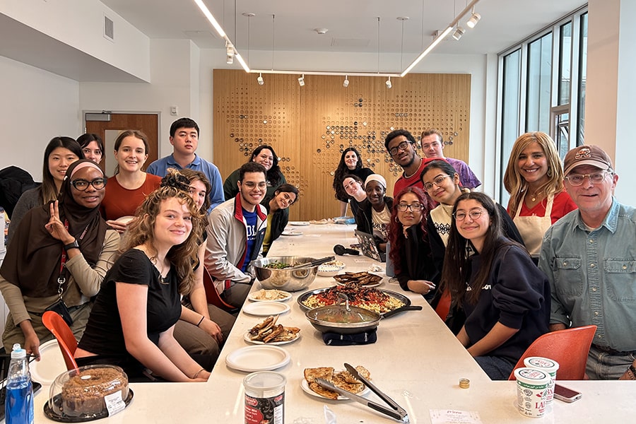 Nevine Abraham and students in her fall 2023 class share a Friendsgiving dinner
