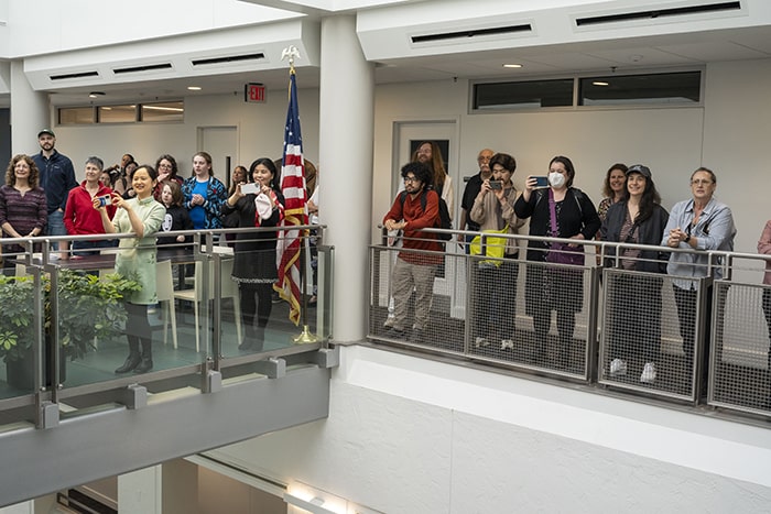 Attendees gather for the unveiling of In the Footsteps of a Stranger