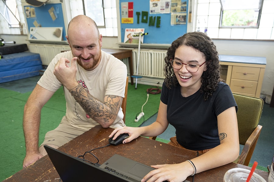 A student and her mentor interact at an internship.