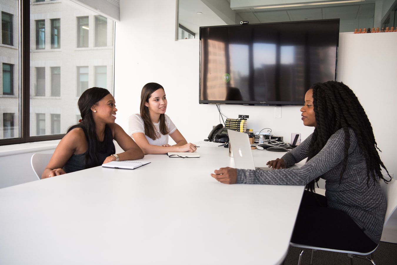 People sitting around a table in a meeting