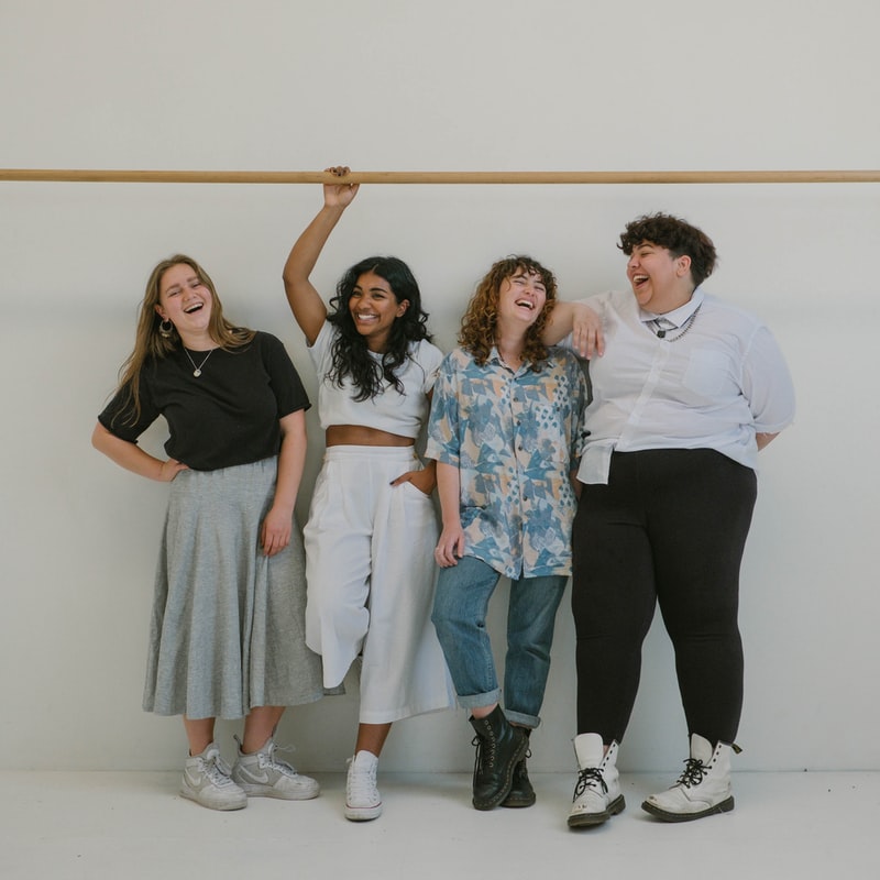 Four women standing 