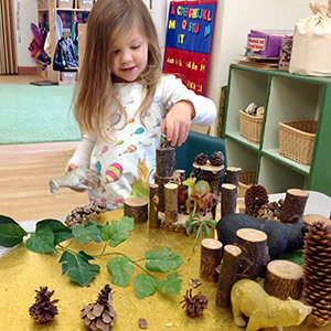 Child creating with loose parts