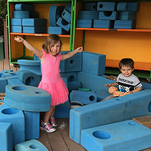 Children playing with outdoor blocks