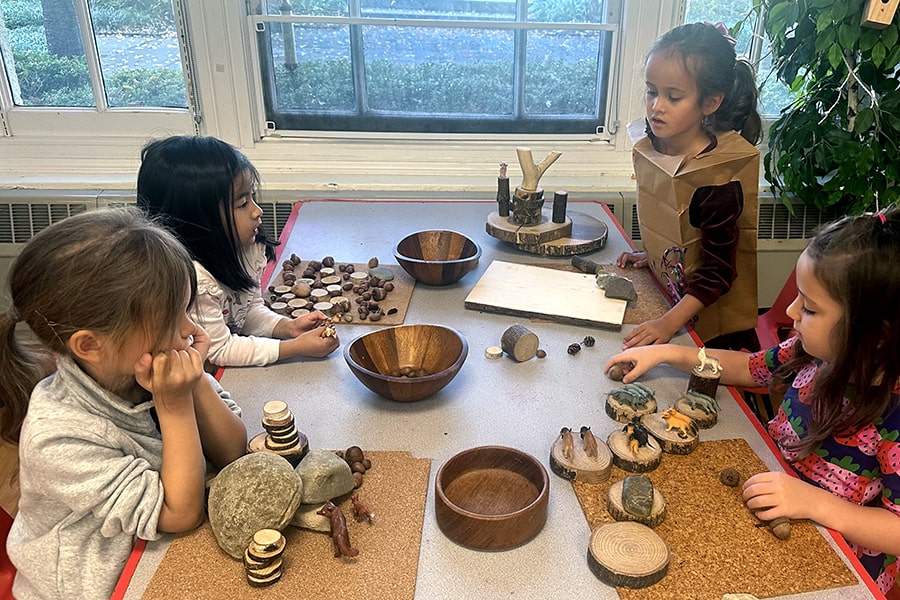 students playing at a table