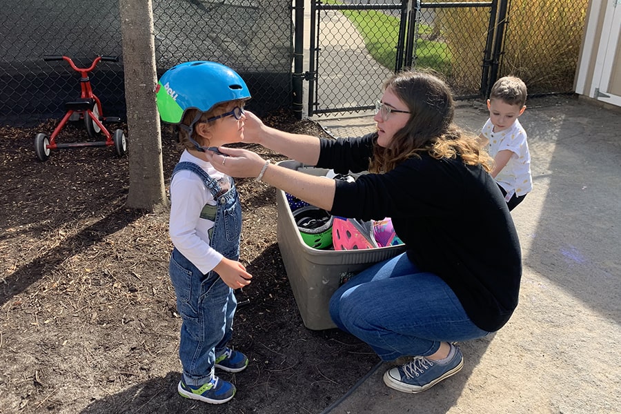 Kate Russo Helping Child