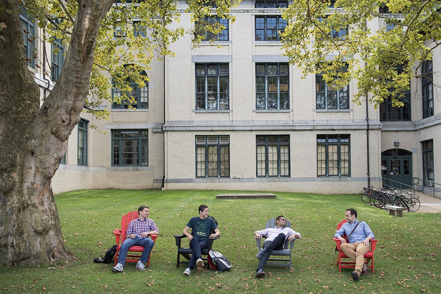 students sitting outside of Baker Hall