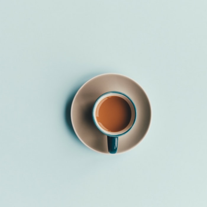 a coffee mug on a blue background