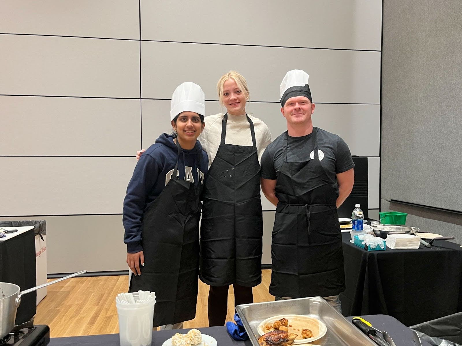 group of CMU Plaidvocates in aprons and chef hats