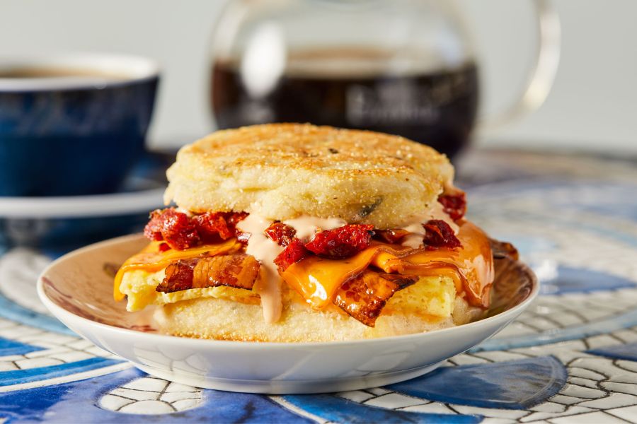 De Fer Coffee & Tea's breakfast sandwich prepared with an English muffin, egg, smoked cheddar and sundried tomatoes