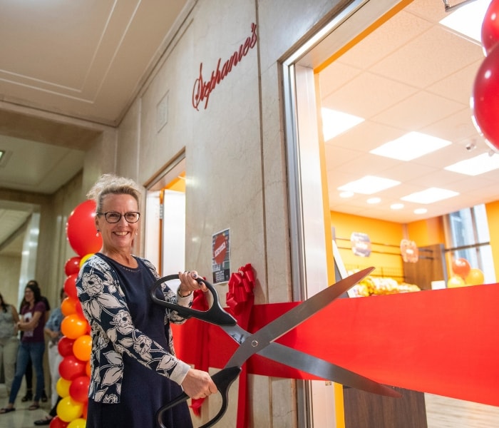 Dean Doerge cuts the grand opening ribbon