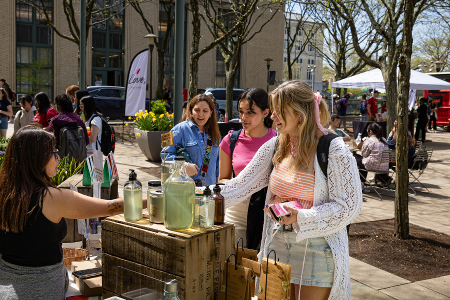 Students shopping at a farmers market