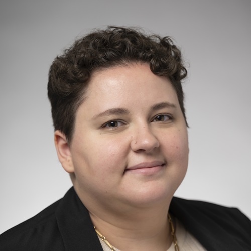 A portrait of Nicole Perrotta with a neutral background.