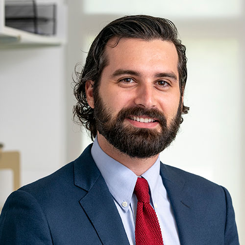 Headshot photograph of Patrick McCue.