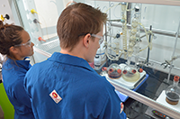 students working in fume hood