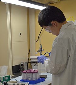 Student in lab wearing PPE