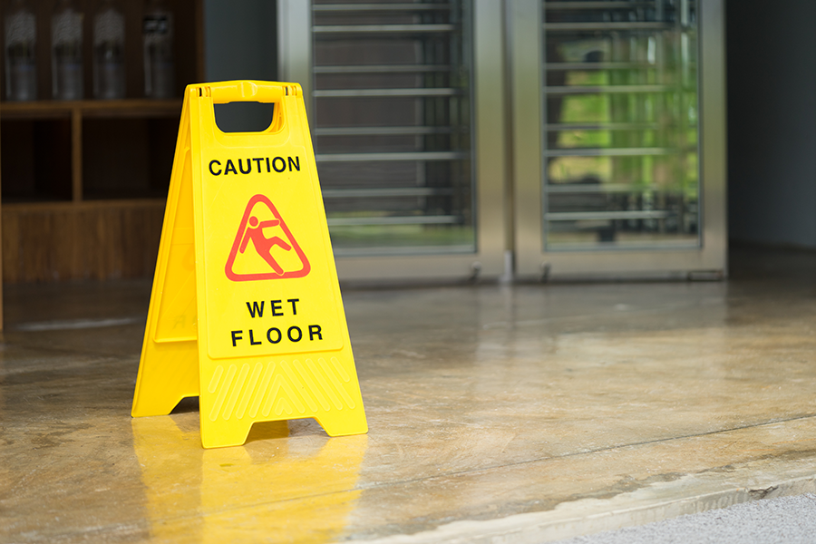 Accident prevention sign wet floors